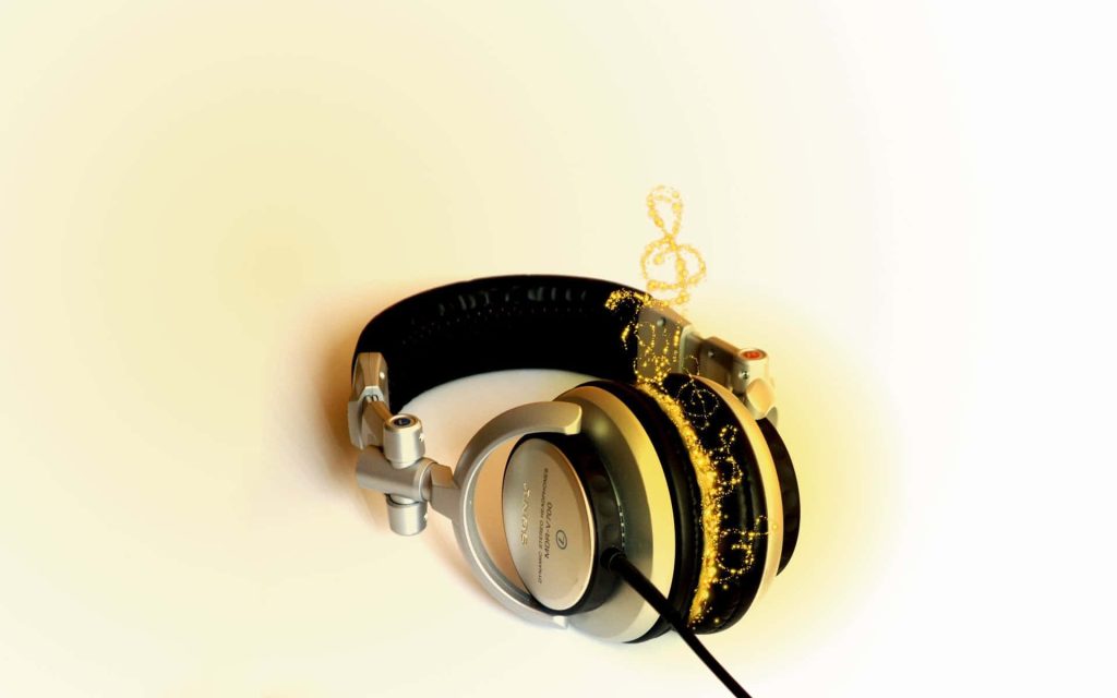 Sony MDR-V700 DJ headphones with glowing gold music notes on clean light background wallpaper