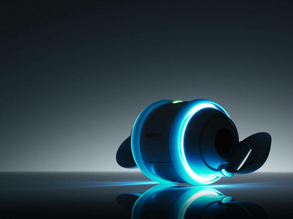 Blue Luminescence: Enchanting Image of Sony Rolly Music Player in the Dark Wallpaper