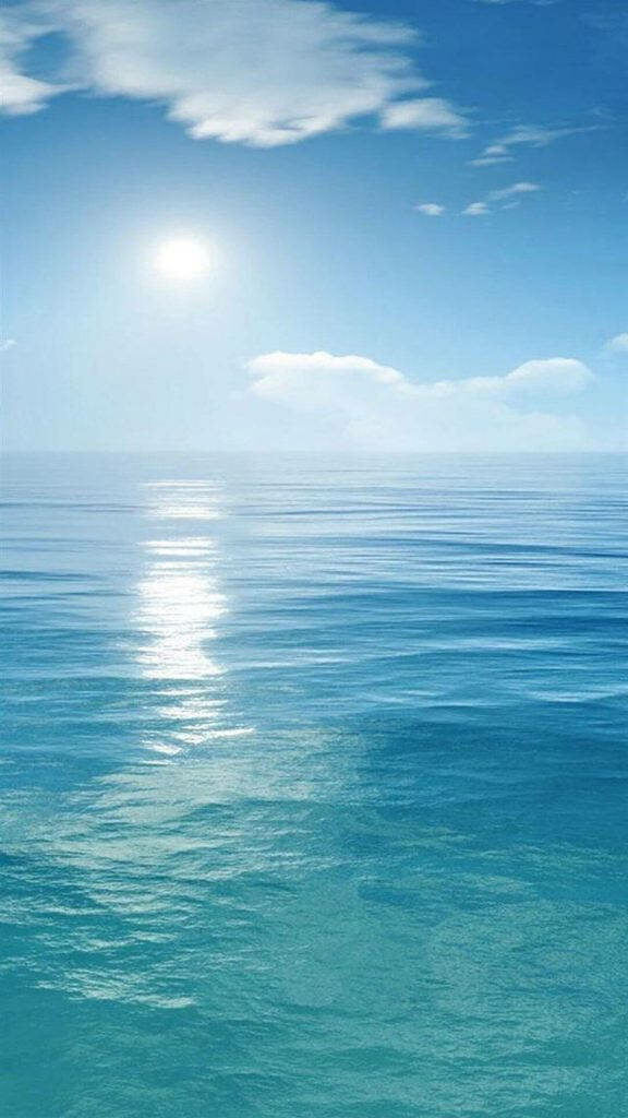 Sunlit Serenity: A Majestic Coastal Vista in iPhone Stock Background Wallpaper