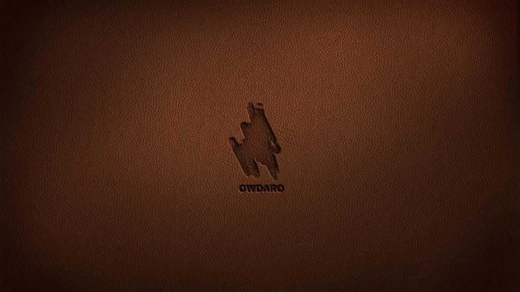 Dark brown leather desktop wallpaper with embossed OWDARO logo and subtle brushstroke emblem