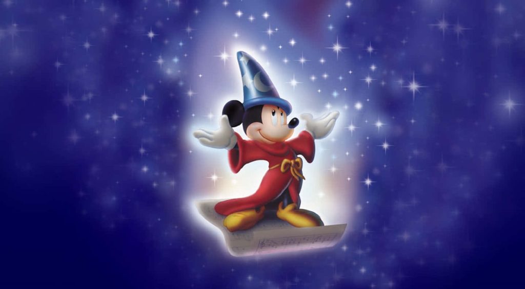 Sorcerer Mickey in red robe and blue hat on floating sheet music with starry night sky background Wallpaper