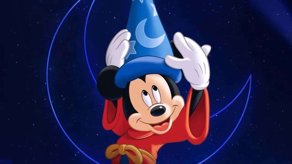 Sorcerer’s Apprentice Mickey Mouse in red robe and blue hat with glowing moon background Wallpaper