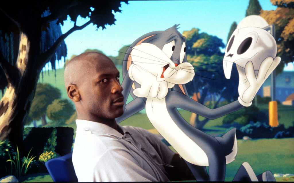 Space Jam: The Iconic Meeting of Legends - Michael Jordan and Bugs Bunny Embrace the Spirit of Competition in a Riveting Still from the 1996 Film Wallpaper
