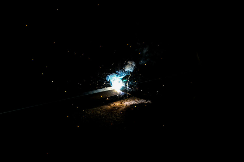 Inspiring the Night: A Captivating 1920x1080 HD Spark Ignition Amidst Dark Background Wallpaper