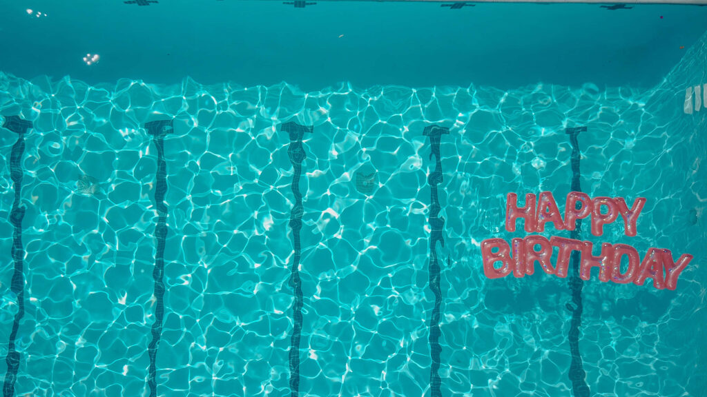 Sparkling Blue Pool Wallpaper: Festive Happy Birthday Background