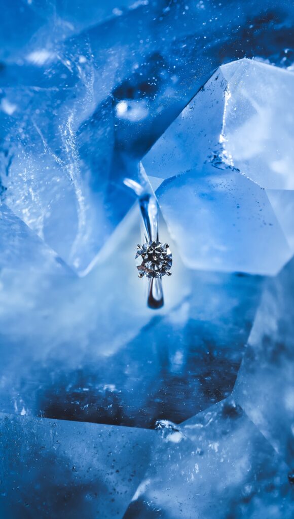 Sparkling Ring Wallpaper: Jewel Close-Up on Ice-Like Background