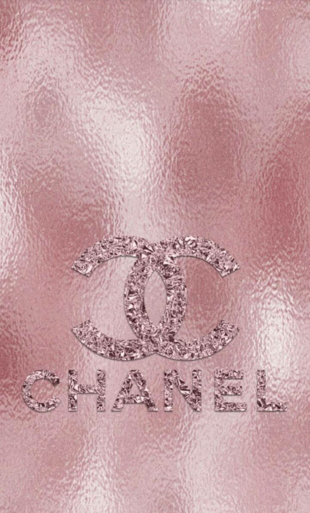 Sparkling pink Chanel logo on textured rose gold background luxury elegant wallpaper design