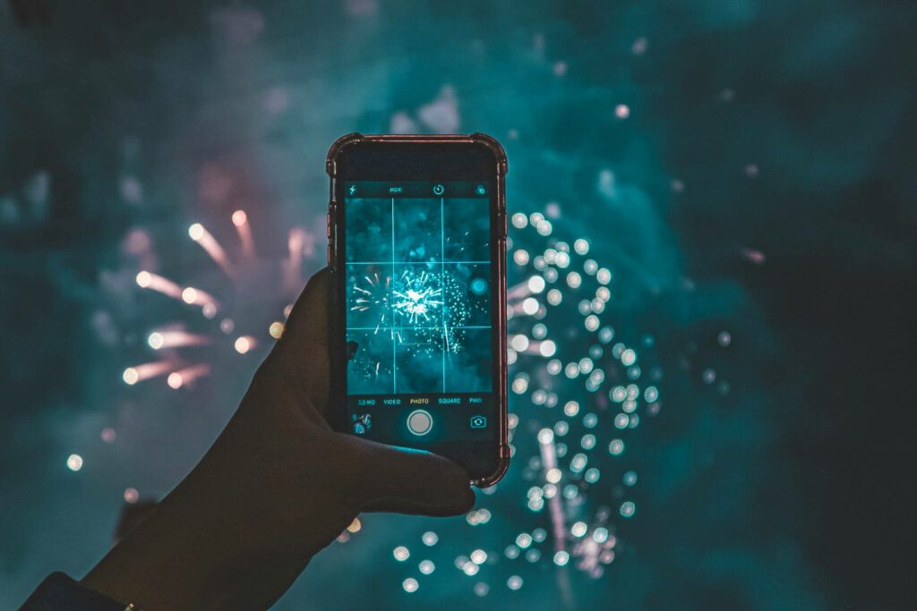 Capturing the Spark: Phone Recordings Illuminate Independence Day Fireworks Wallpaper