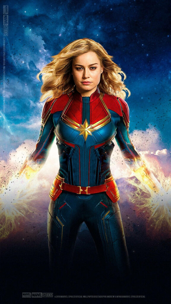 Empowered Marvelous Captain: A Stunning iPhone Wallpaper Showcasing Carol Danvers in her Iconic Stance, Radiating Superpowers