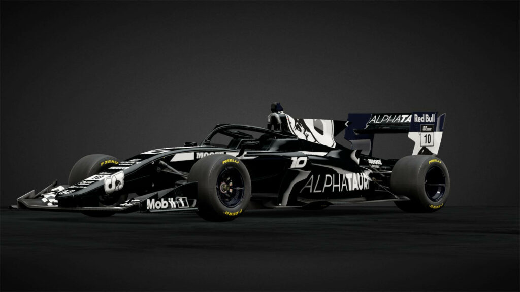 Graceful Alphatauri F1 Racer Captured in Sleek Black Background Highlighting White Body and Bold Black Tires Wallpaper