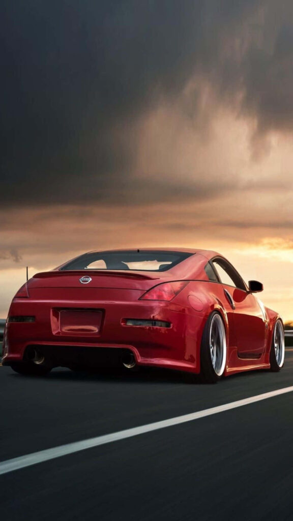 Unleash Your Inner Speed Demon with the Nissan 350Z - A Luxurious Street Racing Experience! Wallpaper