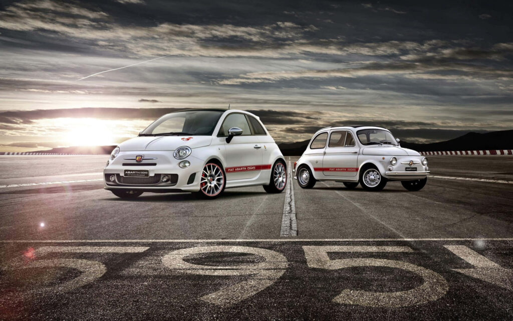 Luxuriously Fast: The Agile Abarth 595 Turismo Roars on Track Wallpaper