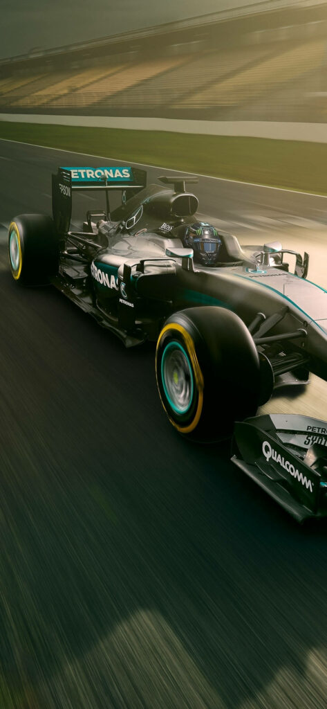 High-Octane Speed: Mercedes F1 Dominates the Empty Track - Striking iPhone Wallpaper