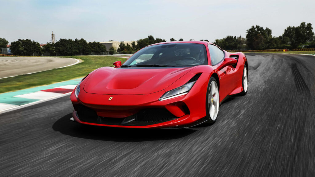 Accelerate in Style: Embrace the Allure of Speed with this Exquisite 4K Ferrari Wallpaper