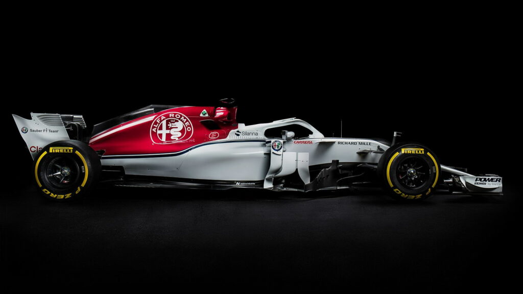 Alfa Romeo Sauber F1 C37 side profile in red white livery on black backdrop high definition wallpaper