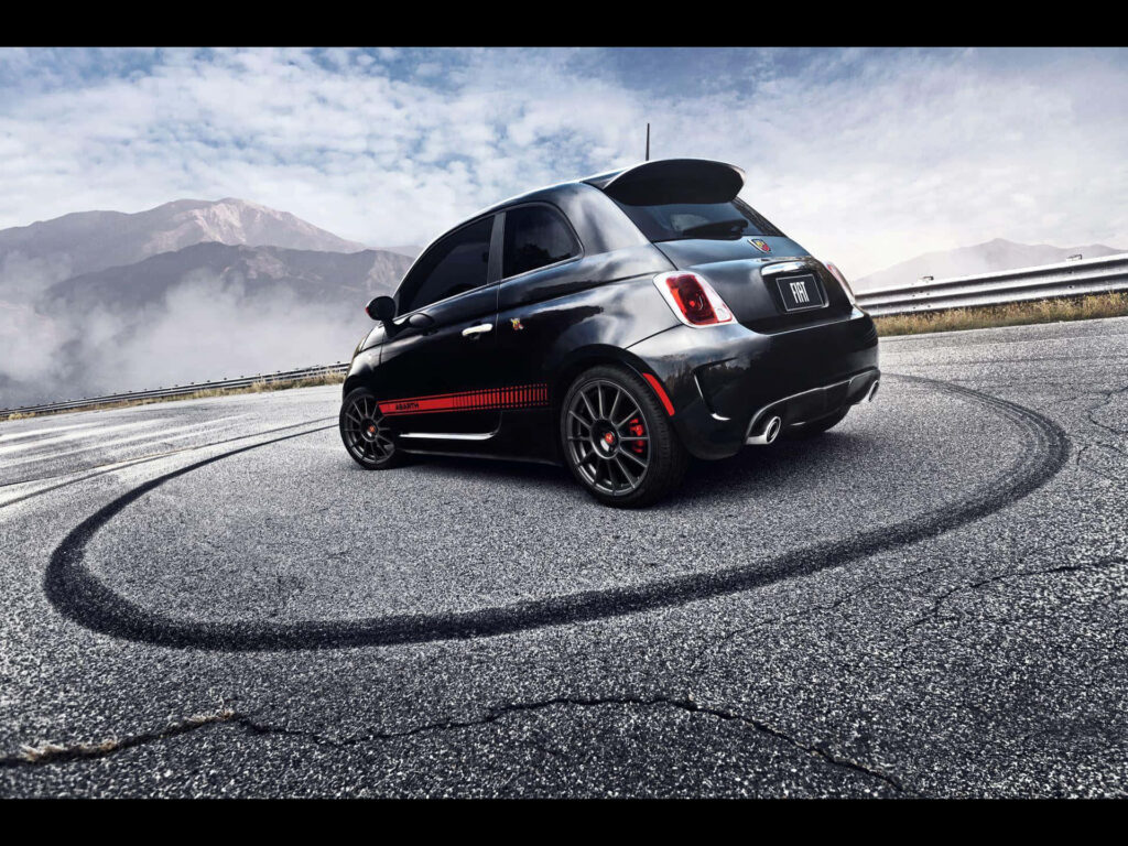 Unleashing the Thrill: Experiencing the Power and Elegance of an Abarth Performance Car Wallpaper