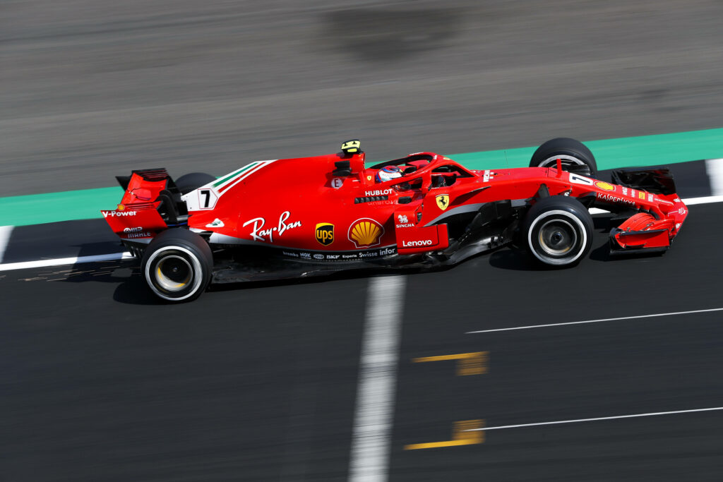 Speed and Grace: Capturing the Thrill of a Ferrari F1 2018 in Motion Wallpaper