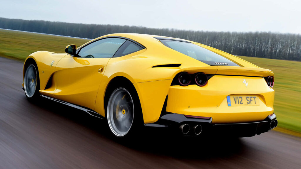Yellow Ferrari 812 on a Road Background Wallpaper