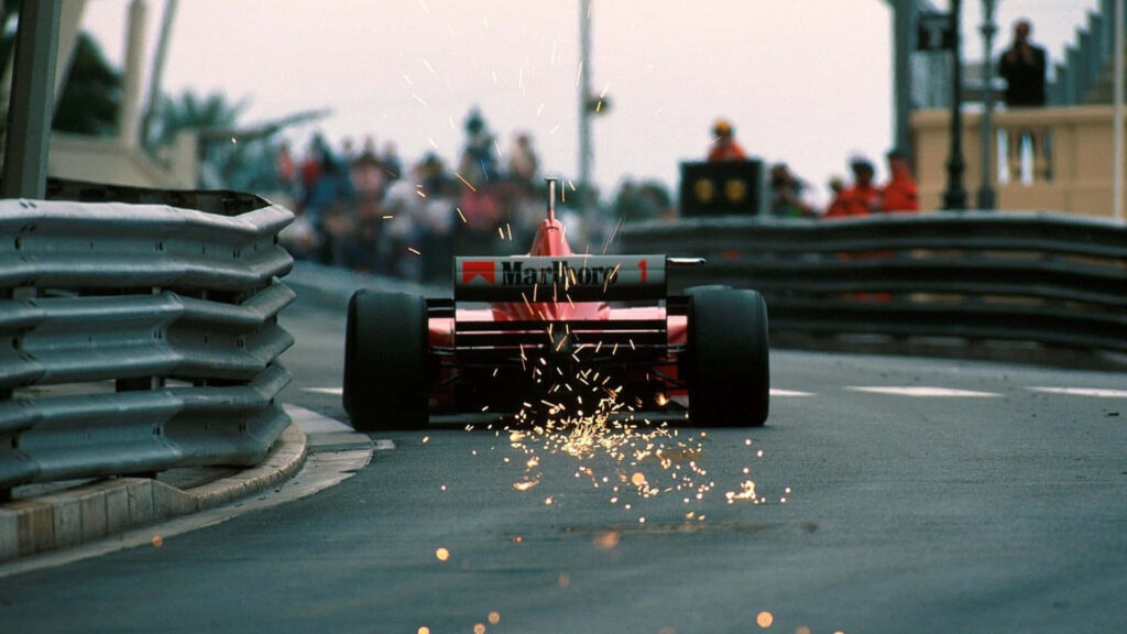 Speeding in Style: Lewis Hamilton's Dazzling Ferrari F1 Takes on the Racing Circuit Wallpaper