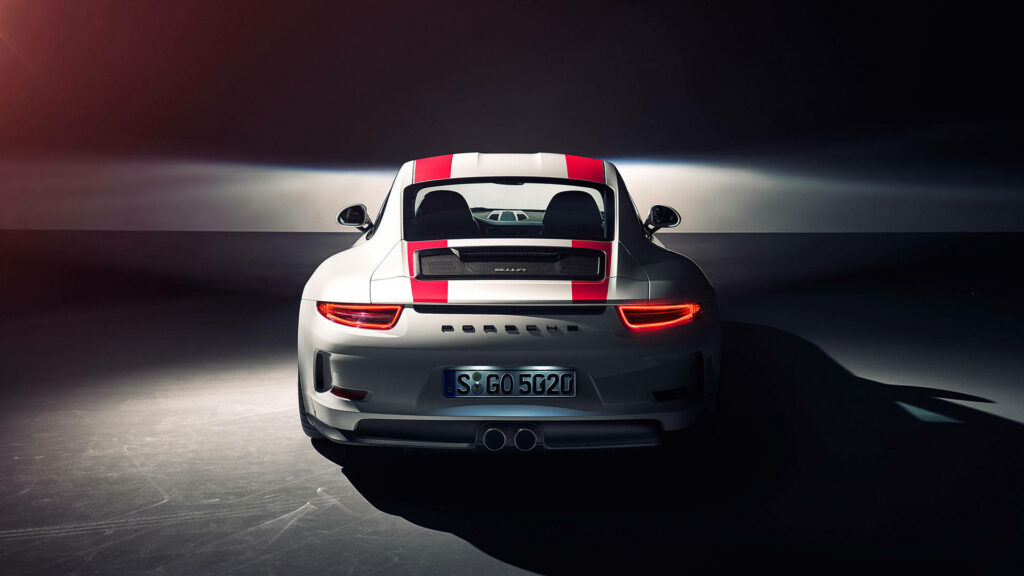 Striped Perfection: White Porsche 911 Wallpaper with Bold Red Accents