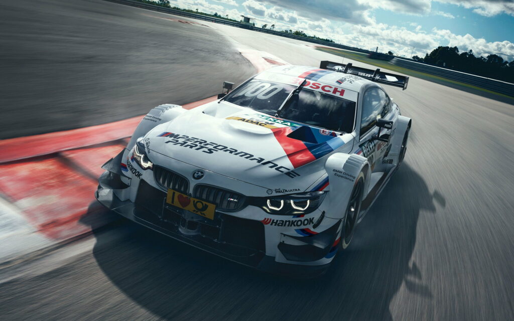 Speed Demon: BMW M4 DTM Unleashed on the Racing Track Wallpaper