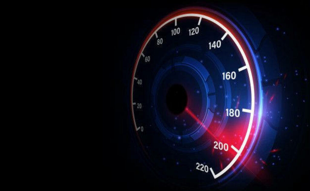 Chromatic Speed: A Dynamic Speedometer Duel on Ebony Canvas Wallpaper
