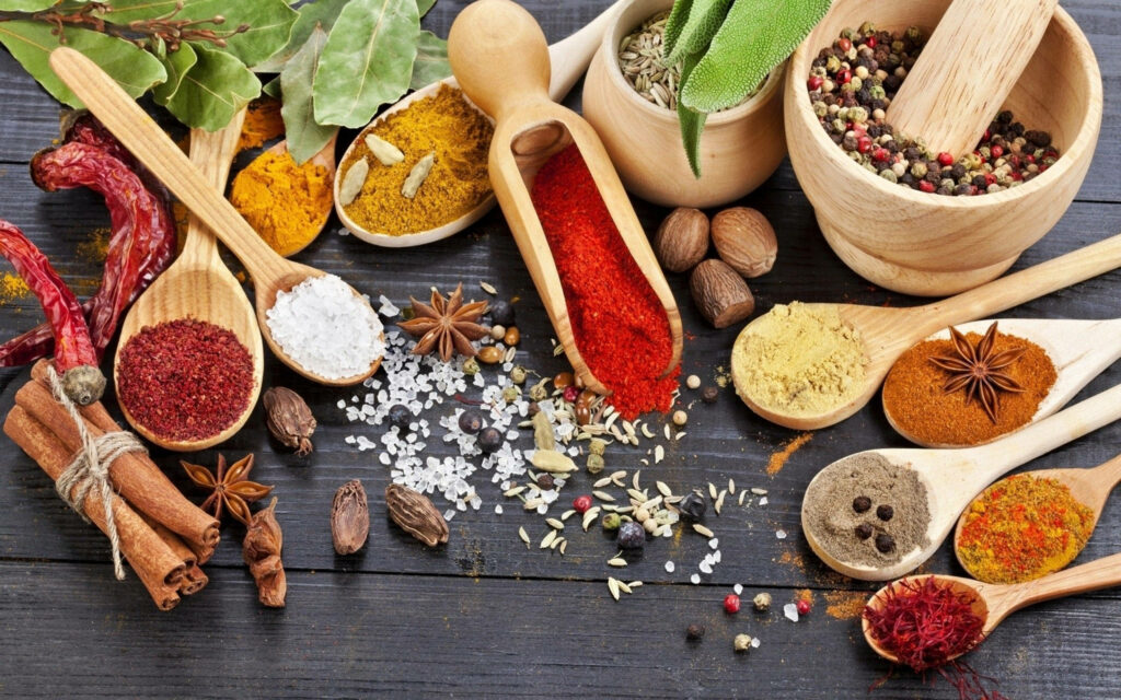Spice Up Your Culinary Delights: Vibrant Aromatic Spices for Flavorful Cooking - An Assorted Spice Drawer Wallpaper.