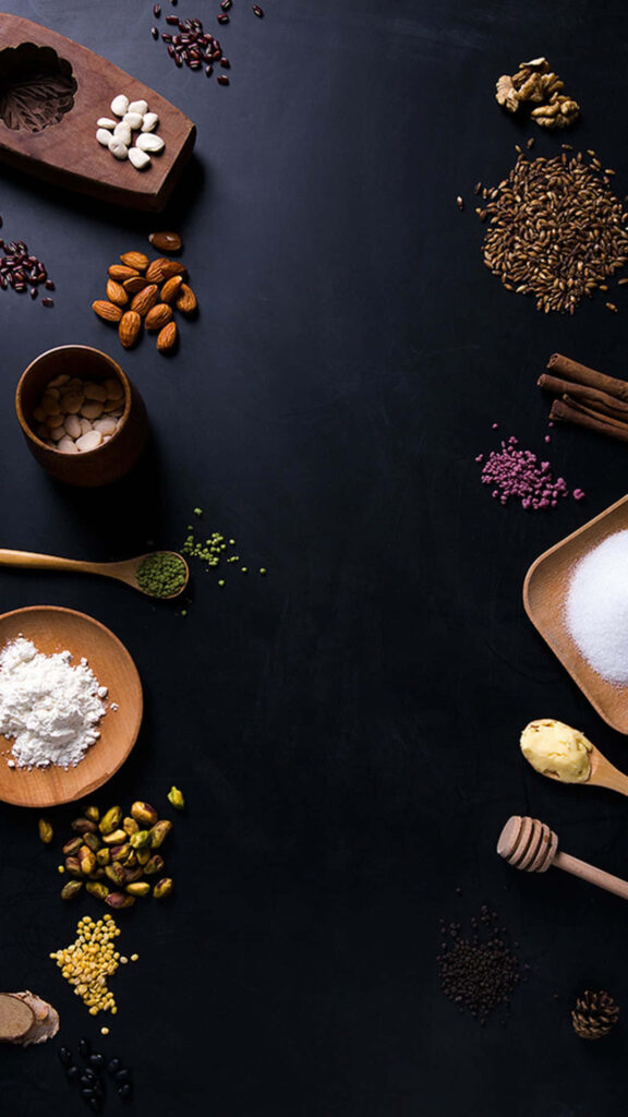 Spice & Nut Wallpaper: Rich Culinary Ingredients on Dark Background