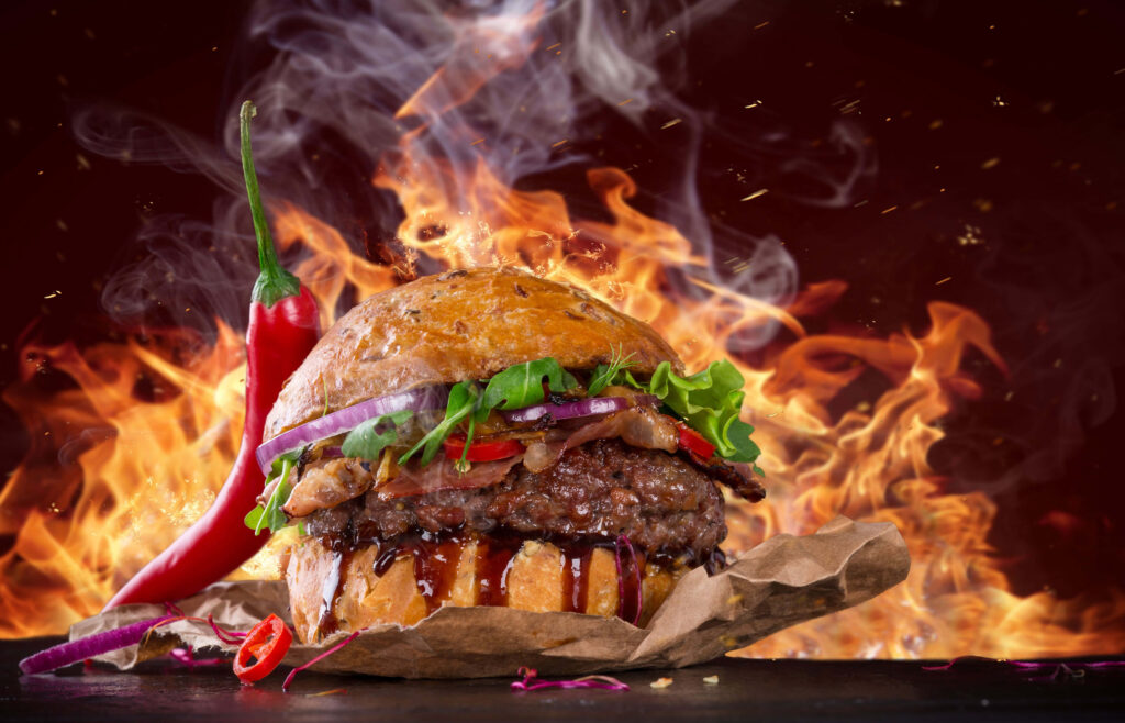 Spicy Burger Wallpaper: Fiery Flames & Fresh Ingredients Delight