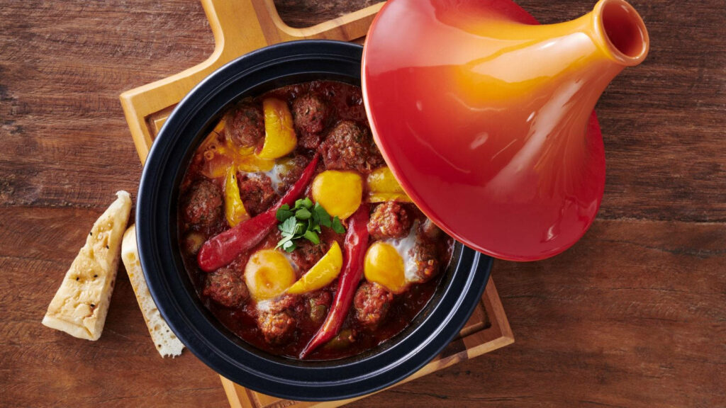 Spicy Tajine Meatball Wallpaper: Colorful Moroccan Dish Background