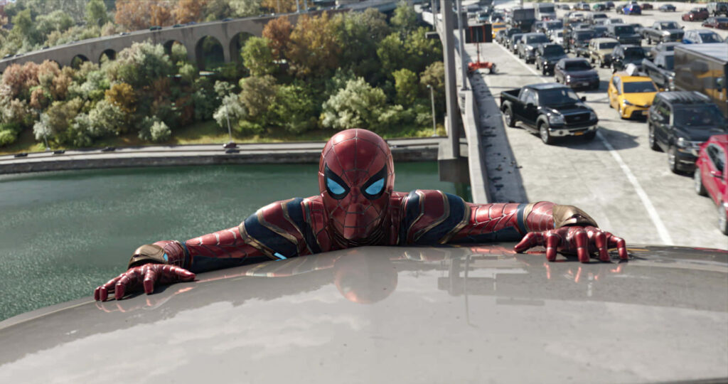 Spider-Man on Busy Bridge: Agility & Determination Wallpaper