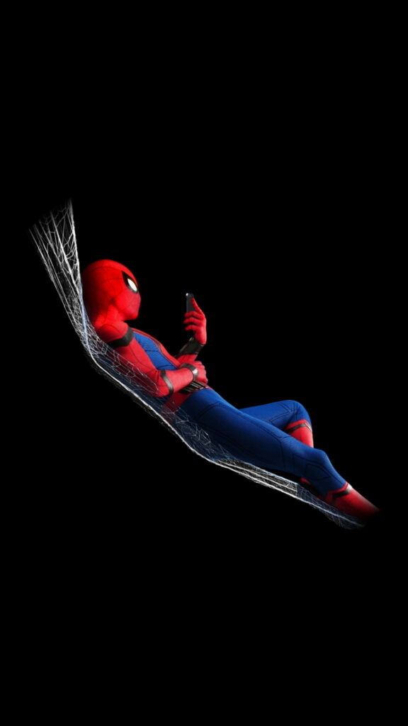 Spider-Man relaxing on web hammock, checking phone on deep black AMOLED HD wallpaper background