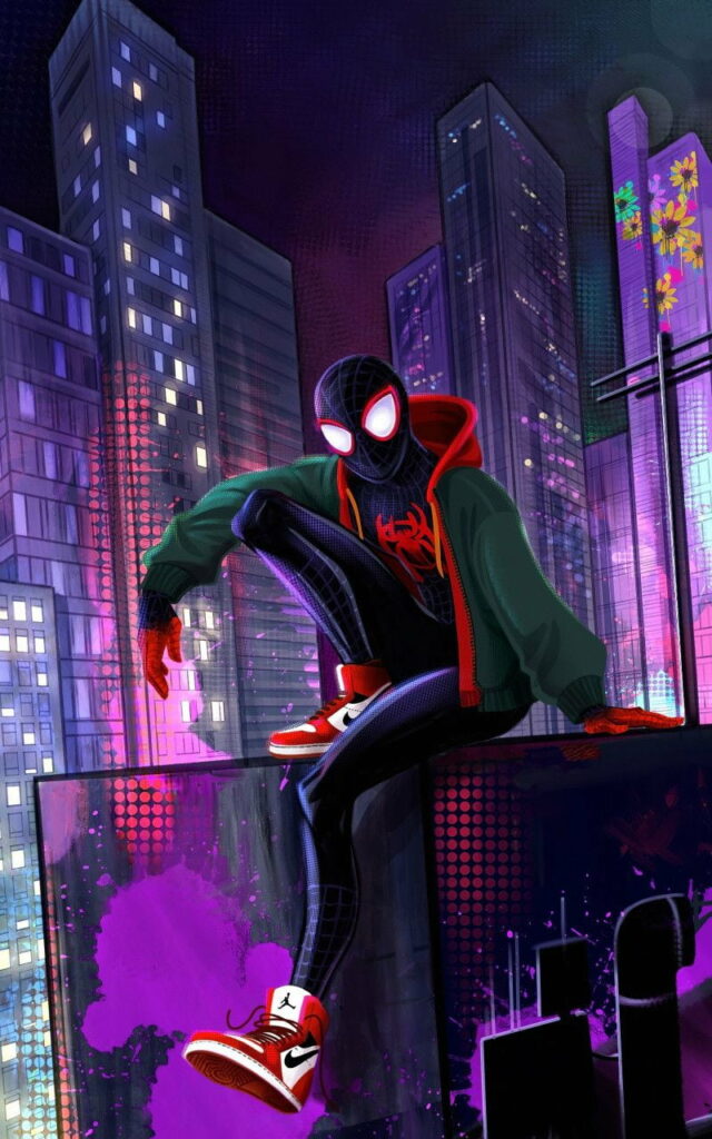 Miles Morales Spider-Man crouching on neon-lit city rooftop at night HD wallpaper background