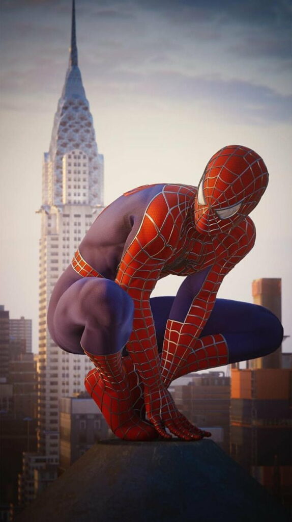 Spiderman crouching on rooftop with Chrysler Building city skyline in HD phone wallpaper background