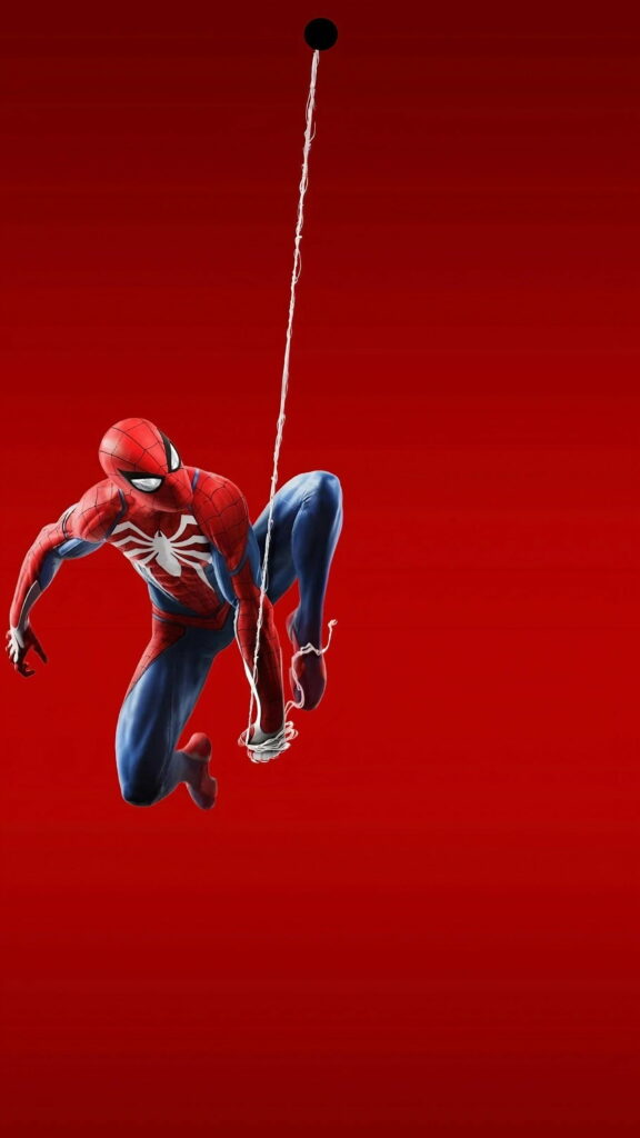 Spider-Man Advanced Suit swinging from phone camera punch-hole on red background wallpaper