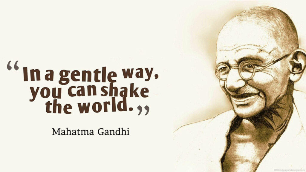 Timeless Wisdom: Commemorating Mahatma Gandhi's Legacy in a Stunning Sepia Portrait Wallpaper