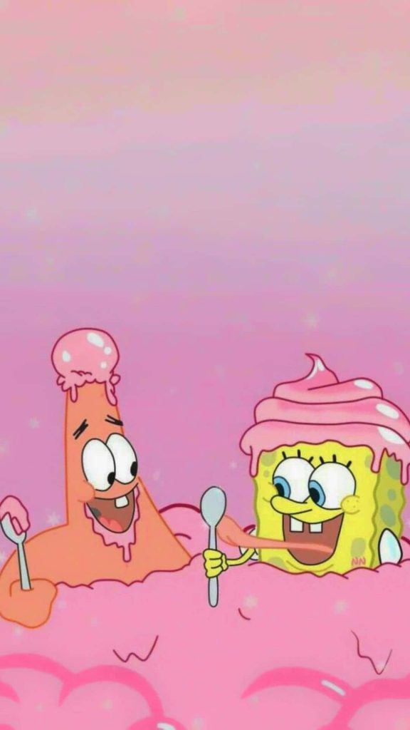 SpongeBob and Patrick laughing with pink frosting on spoons against a sparkly background Wallpaper