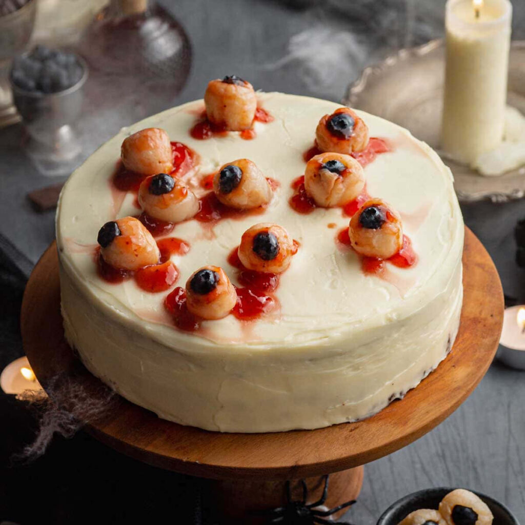 Spooky Halloween Cake with Eye Toppings & Red Syrup Centerpiece Wallpaper