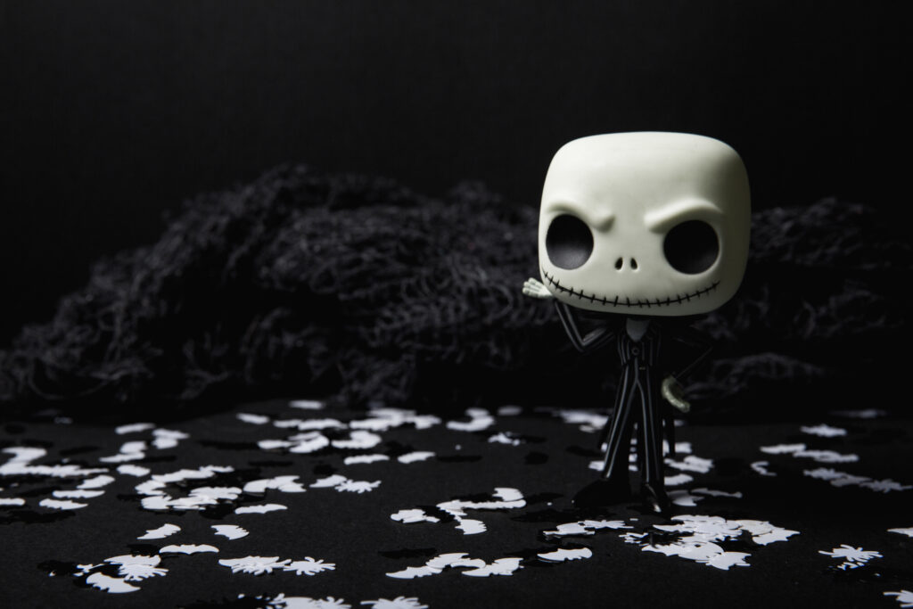 Stylized Skull Doll Wallpaper with Halloween Confetti Background