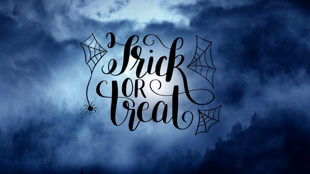 Halloween wallpaper with elegant Trick or Treat calligraphy and spooky forest silhouette