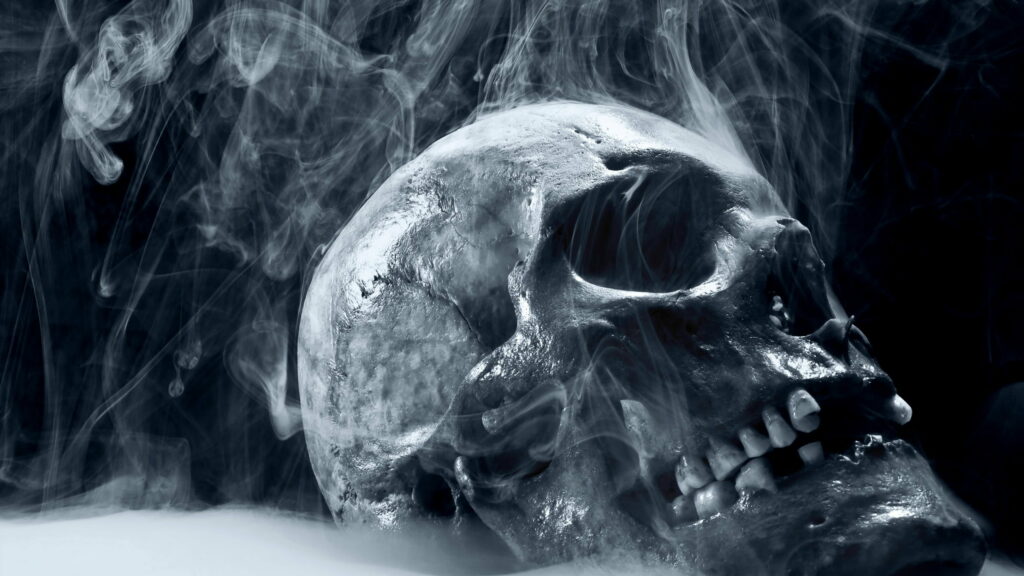 Smoke-Infused Spookiness: A Stunning White Human Skull Illustration in Digital Art Form for QHD Wallpaper Background Photo