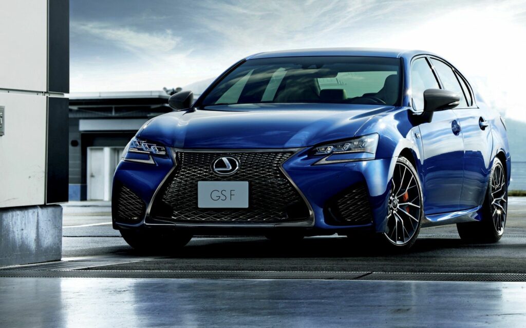 Sleek Blue Lexus GS F: Sporty Sedan in Urban Backdrop Wallpaper
