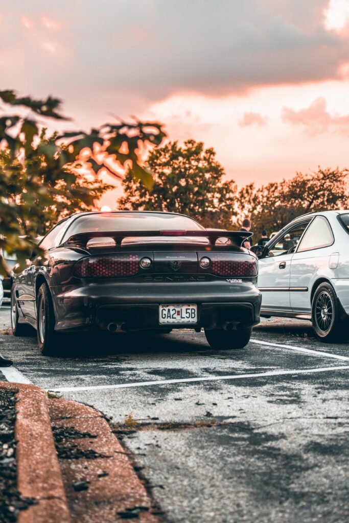 Stunning Pontiac Wallpaper: Sporty Spoiler & Glowing Sky Background