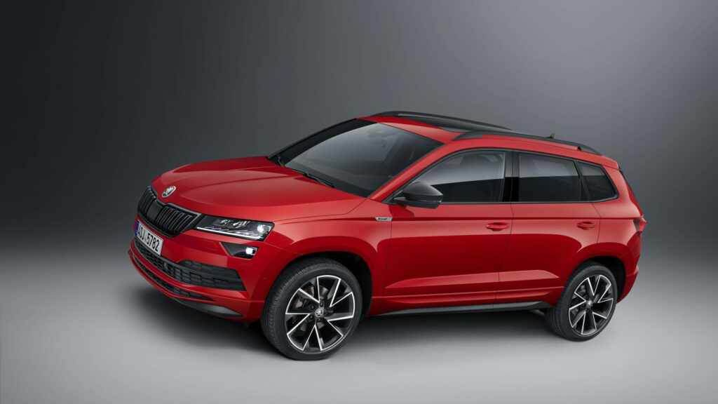 Striking Red Skoda Karoq SUV Wallpaper: Sporty Design & Urban Appeal