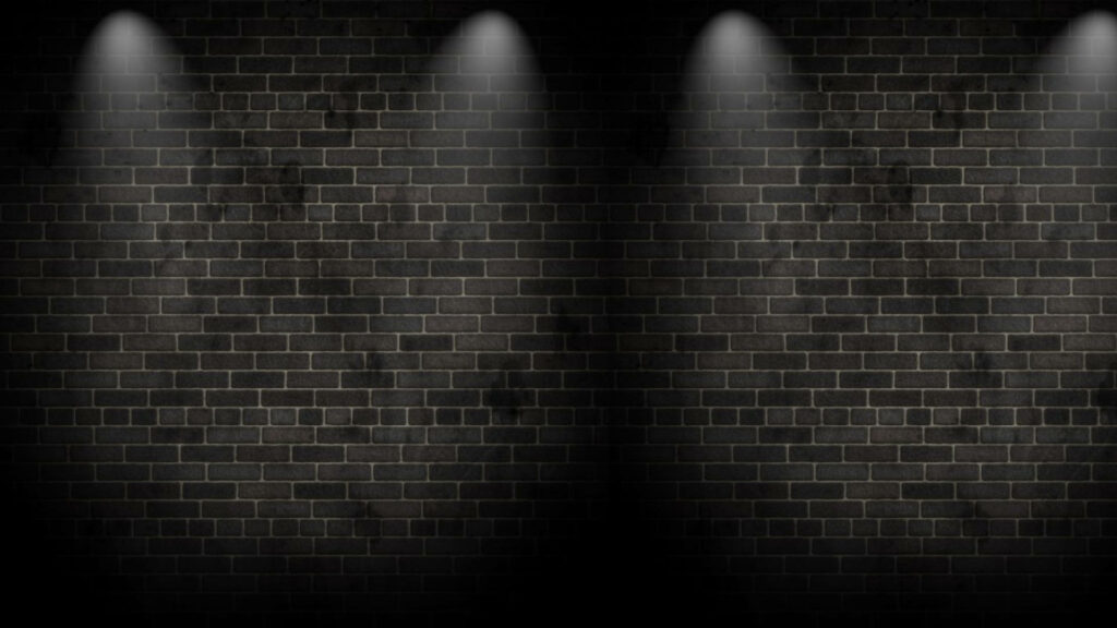 Spotlight Symphony: Captivating Illumination on a Black Brick Canvas Wallpaper