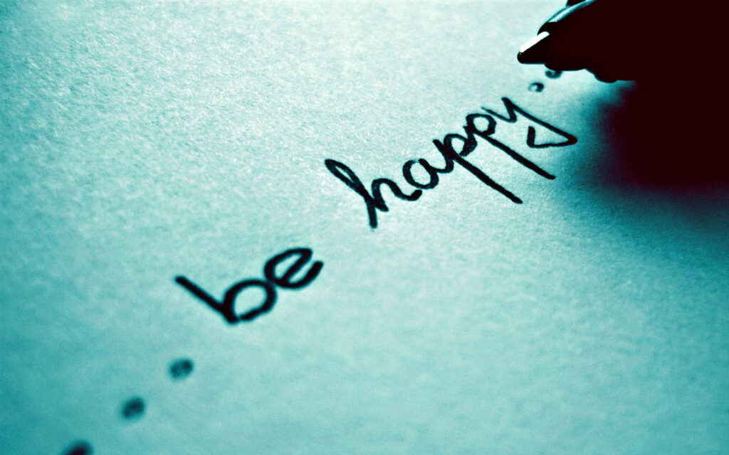 Melancholic Bliss: Black Inked 'Be Happy' Text Wallpaper