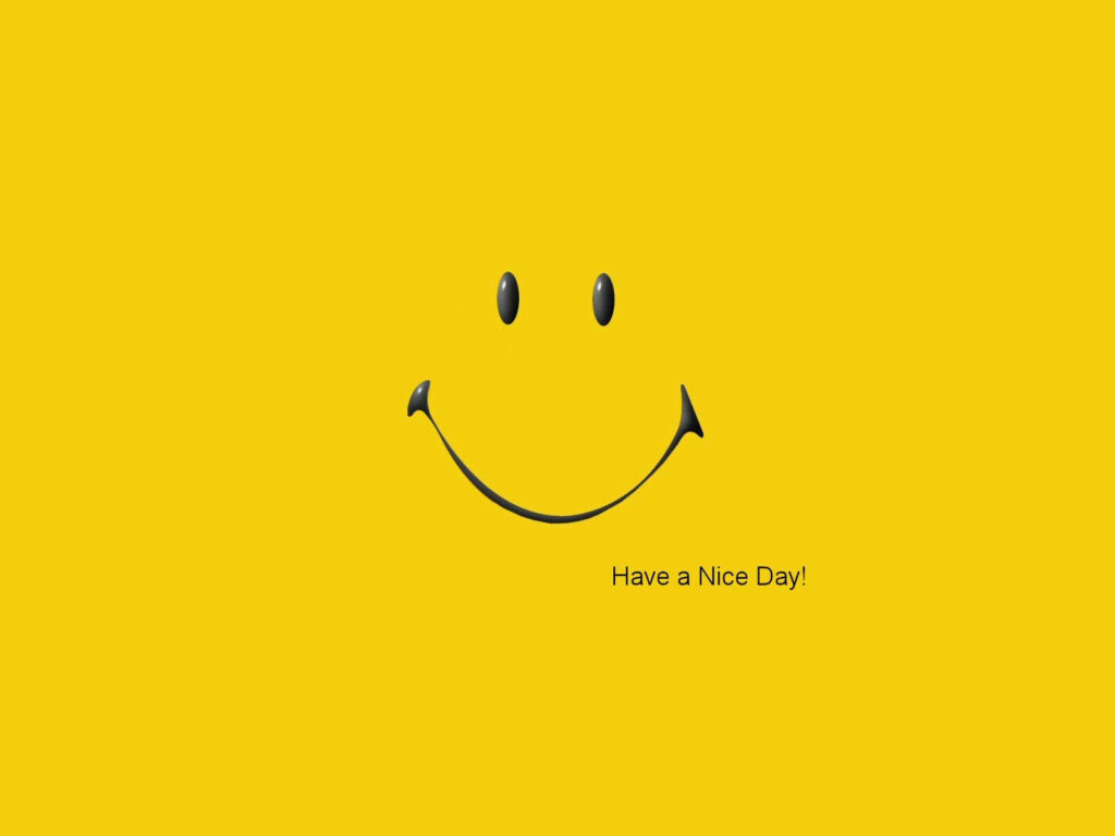Cheerful Smiley Brightens Up Yellow Background with 'Have a Nice Day!' Text Wallpaper