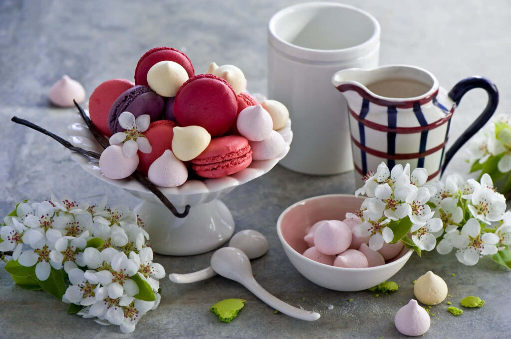 Spring Delights: A Bountiful Array of Fresh Fruit Desserts, Tempting Sweets, and Exquisite Decorations, Set in a Captivating Table Spread Wallpaper
