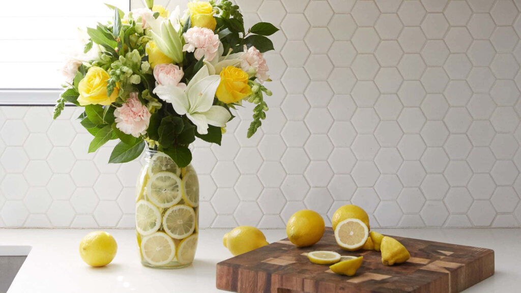 Springtime Kitchen: Bouquet in Jar with Lemon Slices & Fresh Lemons Wallpaper