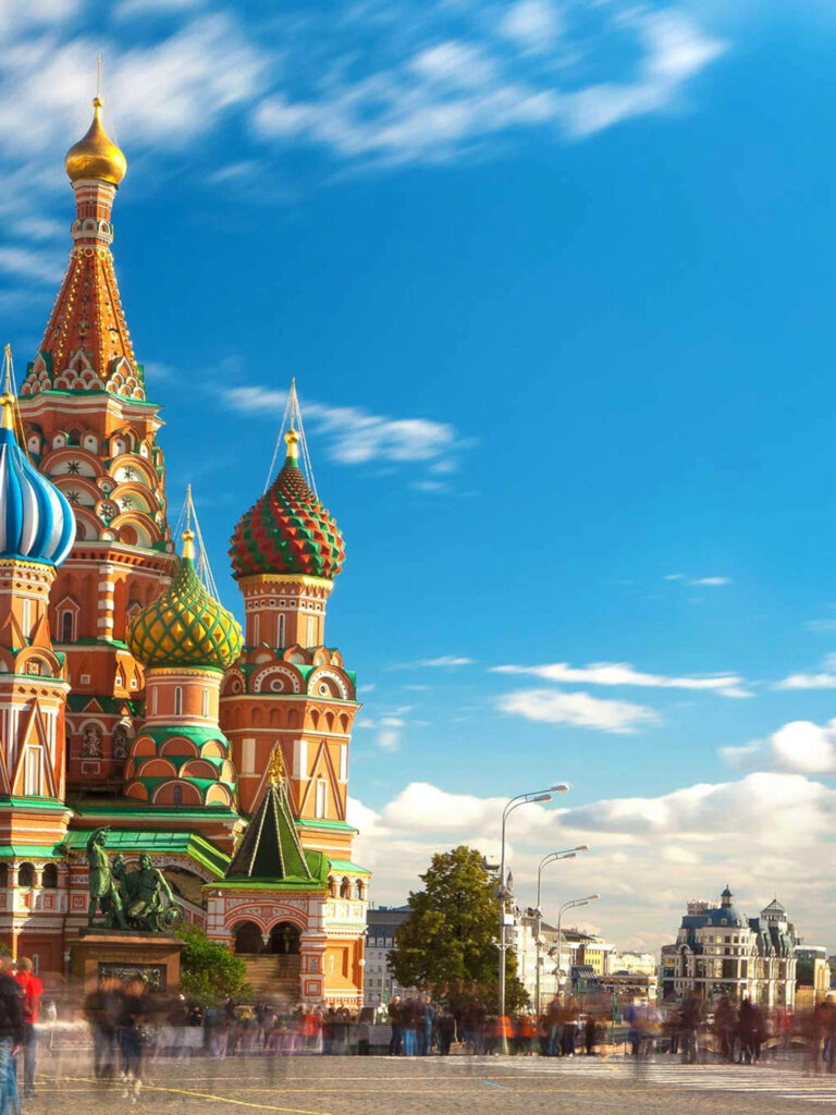 Colorful St Basil’s Cathedral Moscow with vibrant onion domes under clear blue sky wallpaper